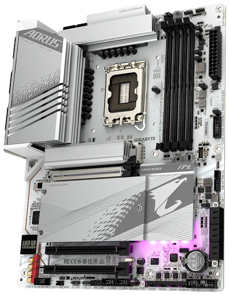 Srebrna płyta główna komputera z logo marki w lewym górnym rogu oraz wieloma gniazdami na pamięć RAM, procesor i karty rozszerzeń.