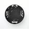 Czarna, okrągła podstawa uchwytu czujnika kamery z metalowymi zaciskami i otworami, widziana z góry.