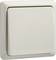 Biały włącznik światła w kształcie kwadratu, zamontowany na ścianie.
