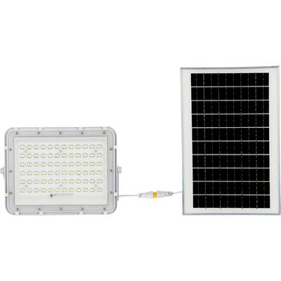 Reflektor LED zasilany panelem słonecznym. Lampa składa się z wielu małych diod LED, a panel z kilku ogniw fotowoltaicznych.