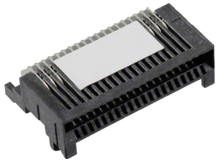 Zbliżenie czarnego złącza elektronicznego z licznymi metalowymi bolcami i białą etykietą na górze, używanego w zastosowaniach technicznych.