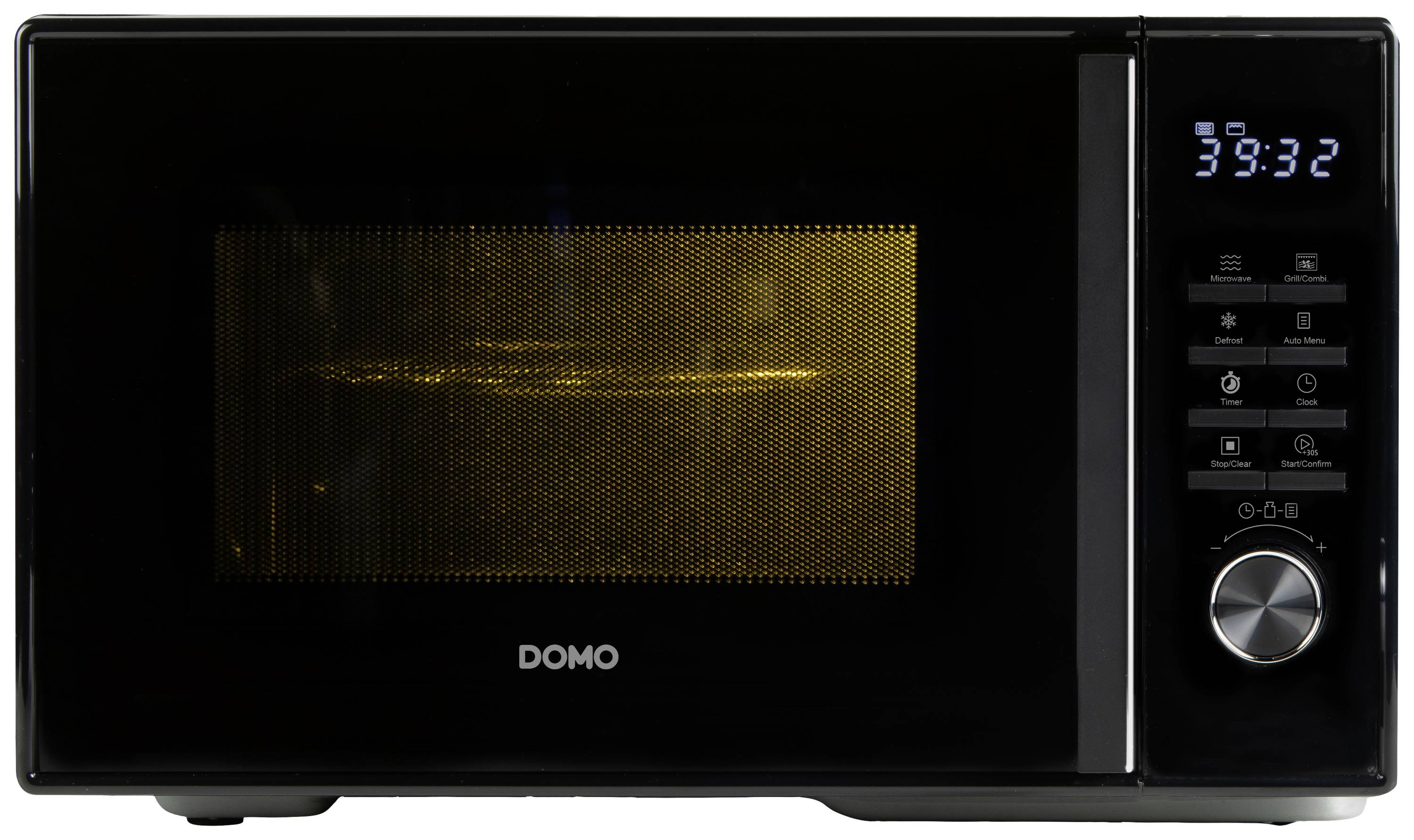 Czarna mikrofalówka z cyfrowym wyświetlaczem, pokazująca godzinę 39:32. Po lewej stronie widoczne jest podświetlone wnętrze przez kratkę.