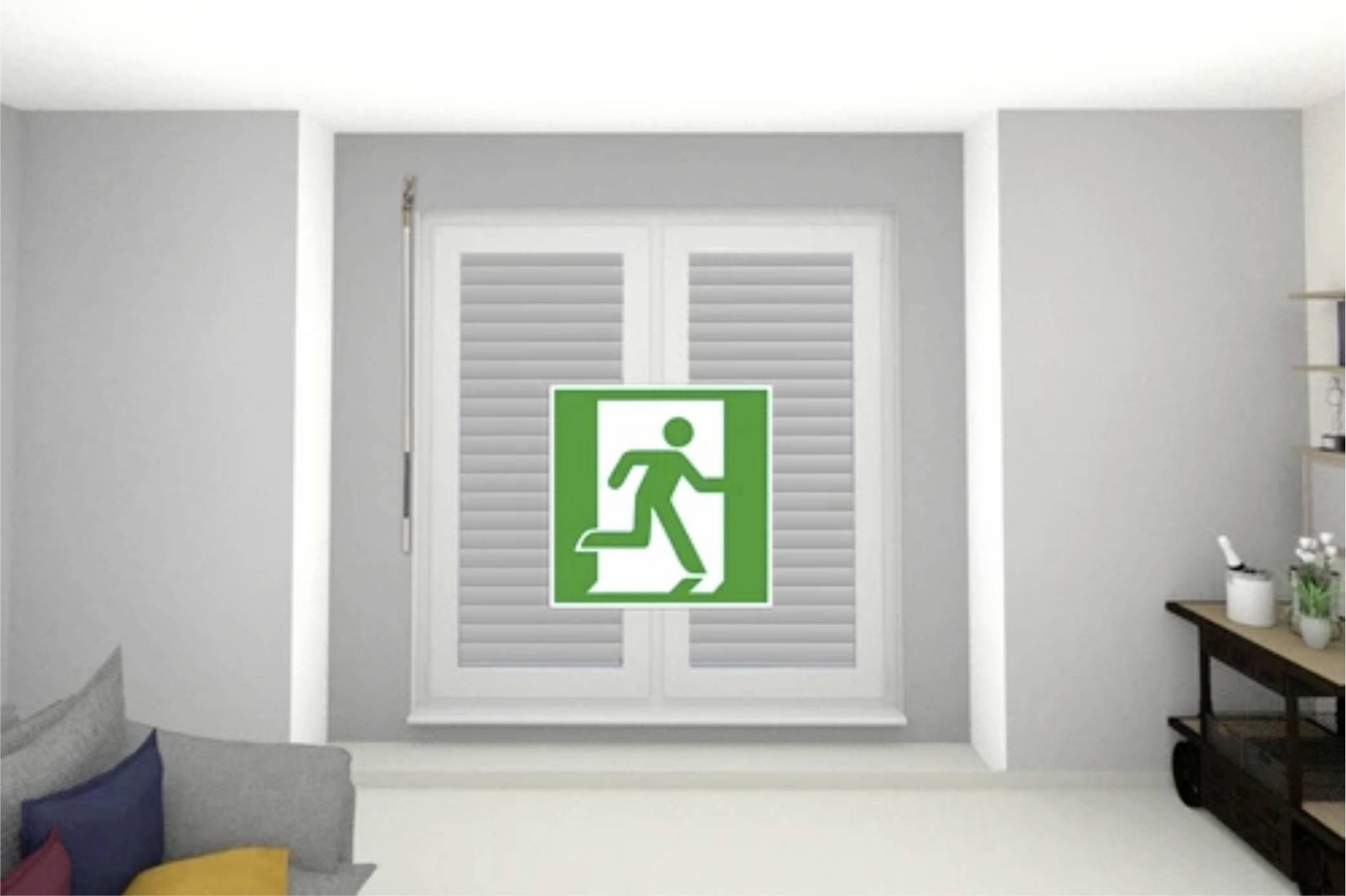 Znak drogi ewakuacyjnej przedstawiający biegnącą postać, na zielonym tle z białą strzałką, wskazuje wyjście awaryjne przy zamkniętym oknie.