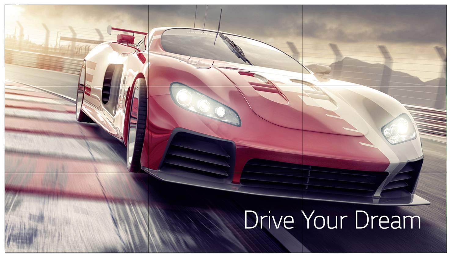 Czerwony samochód sportowy mknie szybko po torze wyścigowym. Na pierwszym planie widnieje slogan 'Spełnij swoje marzenie'.