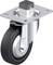 Rolka skrętna z szarym kołem i metalową obudową, odpowiednia do lekkich i średnich obciążeń, stosowana w przemyśle transportowym.