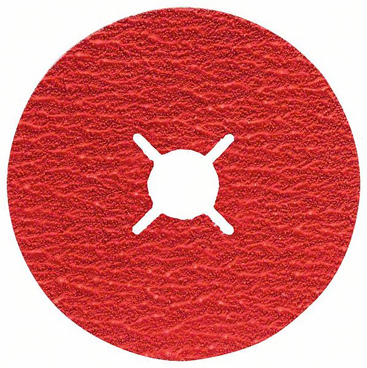 Czerwona tarcza ścierna o szorstkiej teksturze z gwiazdkowatym otworem pośrodku, na białym tle.
