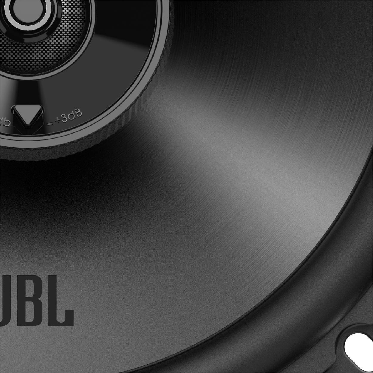 Zbliżenie głośnika o błyszczącej powierzchni z logo 'JBL' w dolnej części.