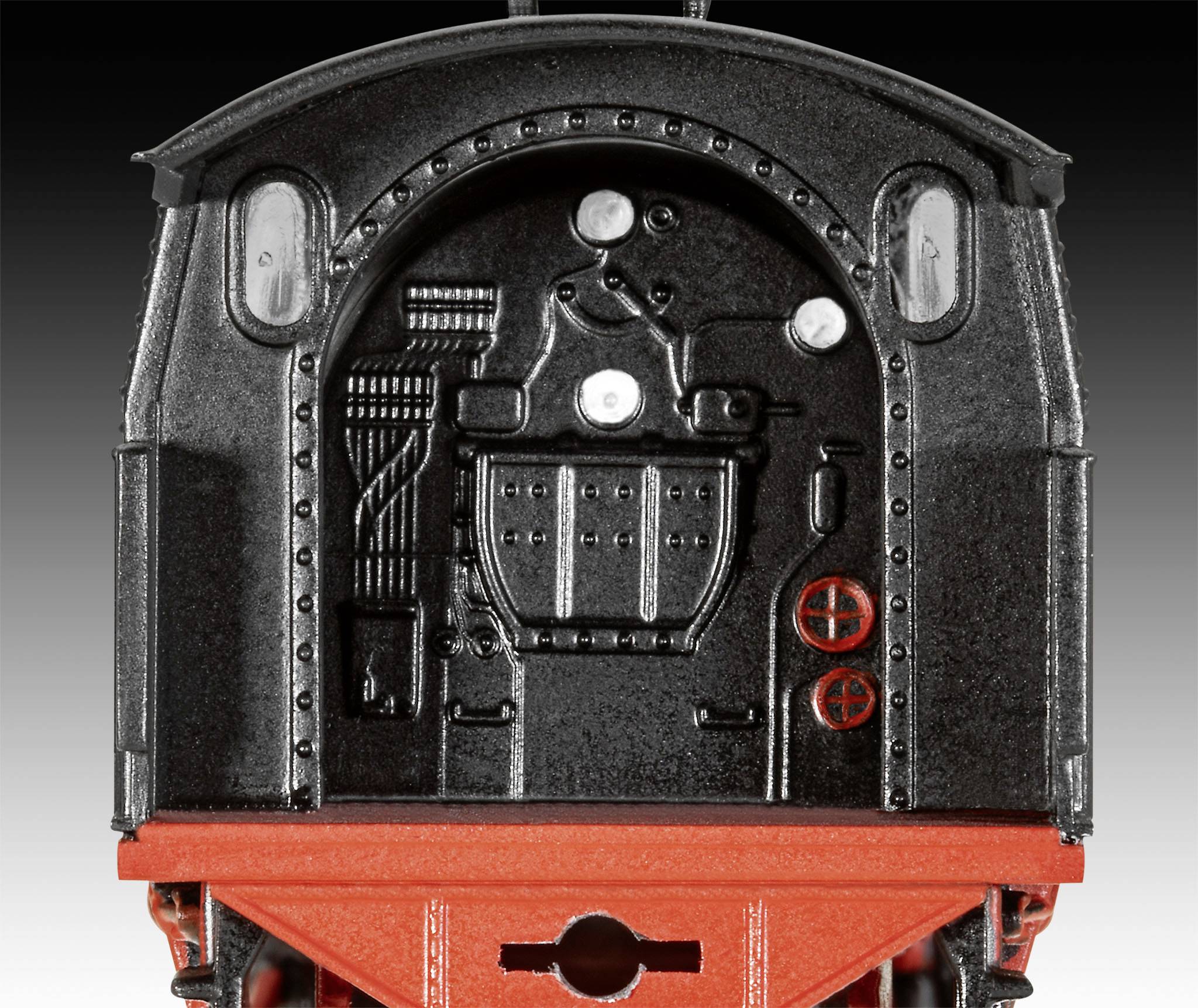 Czarny, prostokątny metalowy pojemnik z czerwonymi akcentami i widocznymi elementami mechanicznymi na przedniej ścianie.