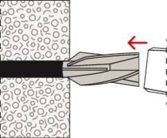 Otwór wiercony z kołkiem wprowadzanym do ściany. Strzałka wskazuje kierunek wprowadzania kołka.