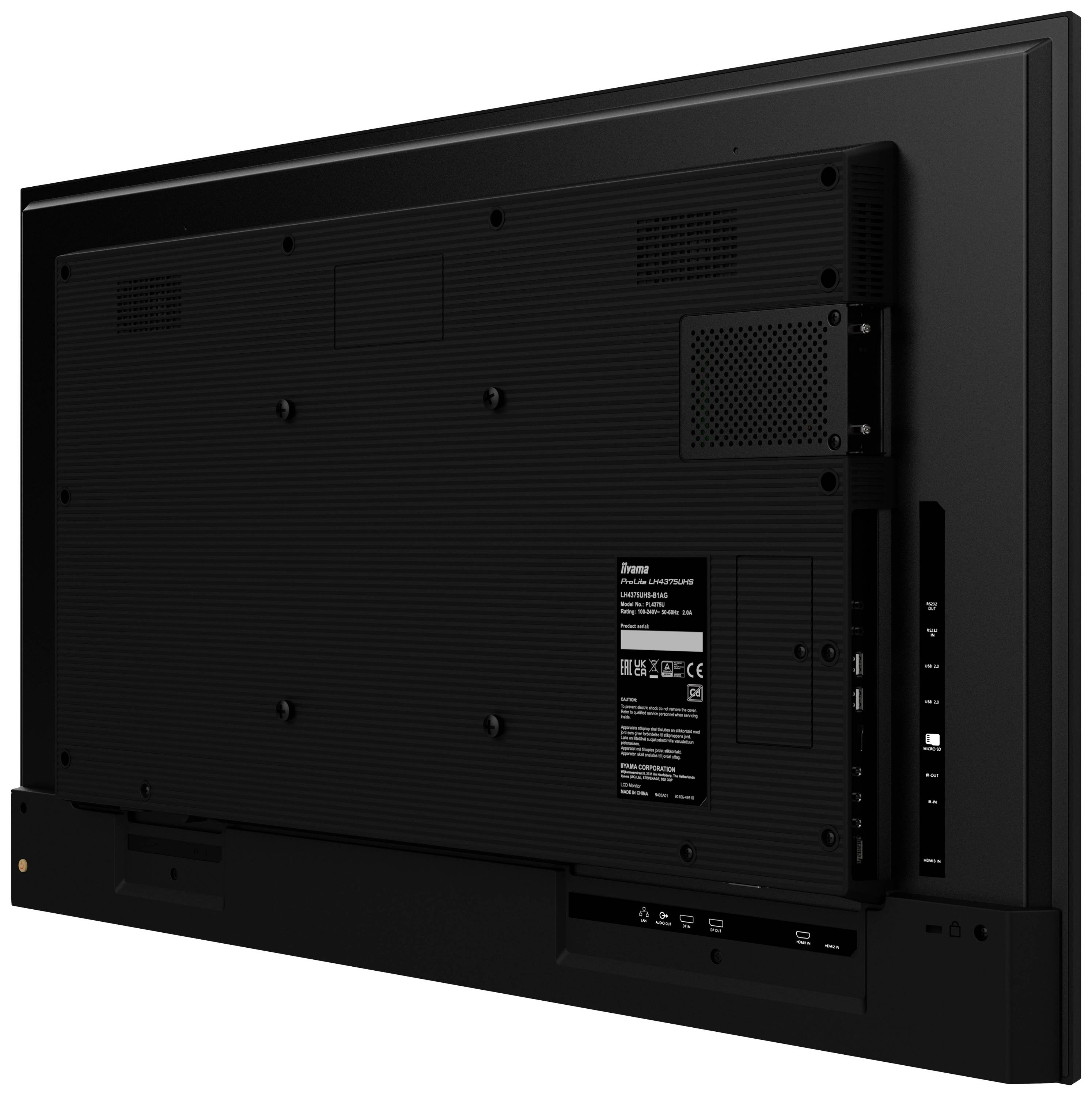 Tylna strona czarnego telewizora z wieloma gniazdami przyłączeniowymi oraz etykietą z informacjami technicznymi.