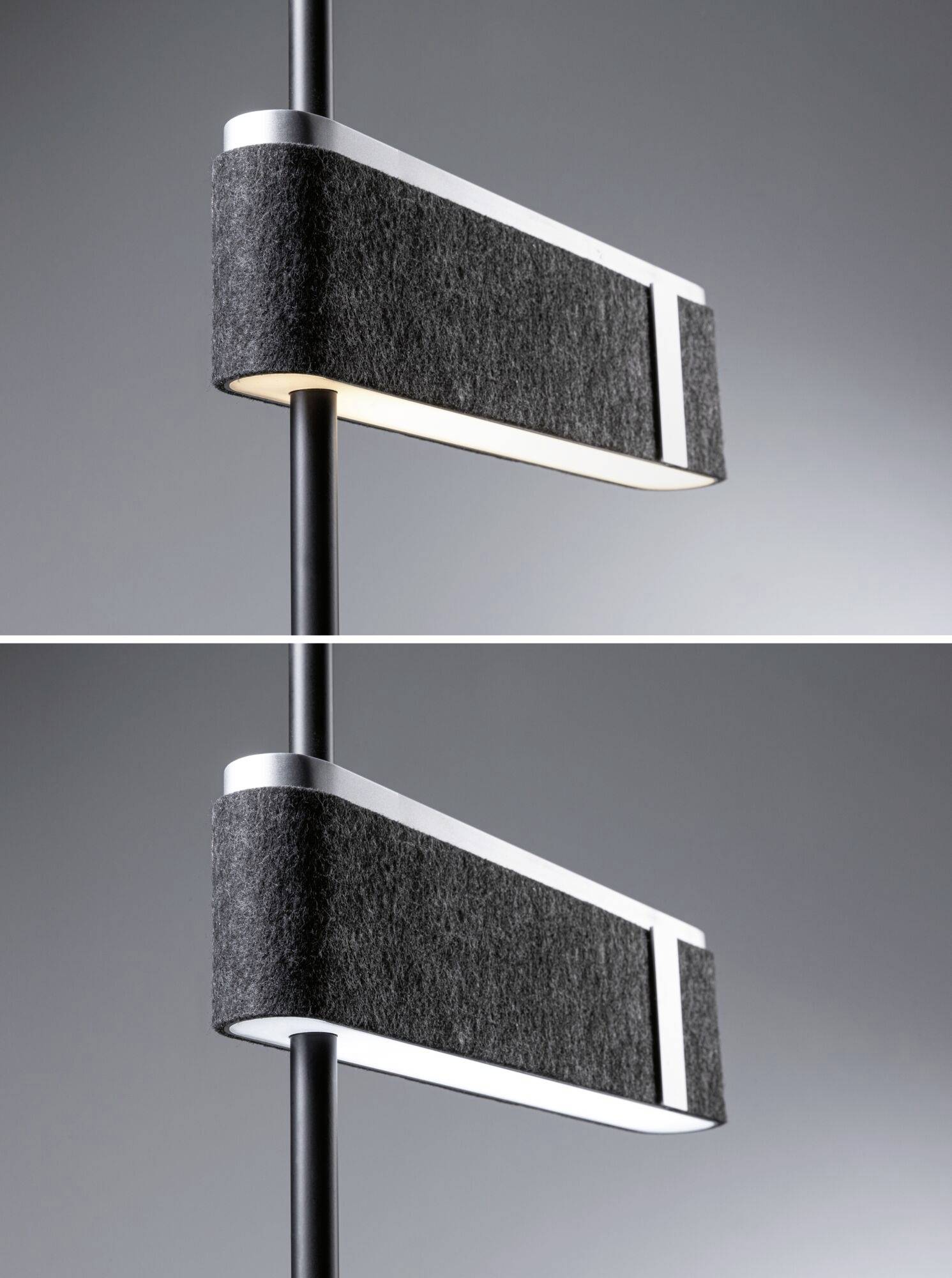 Dwie nowoczesne, prostokątne lampy wiszące z czarnym materiałowym abażurem i srebrnymi elementami, skierowane światłem w dół. Prosta, współczesna stylistyka.