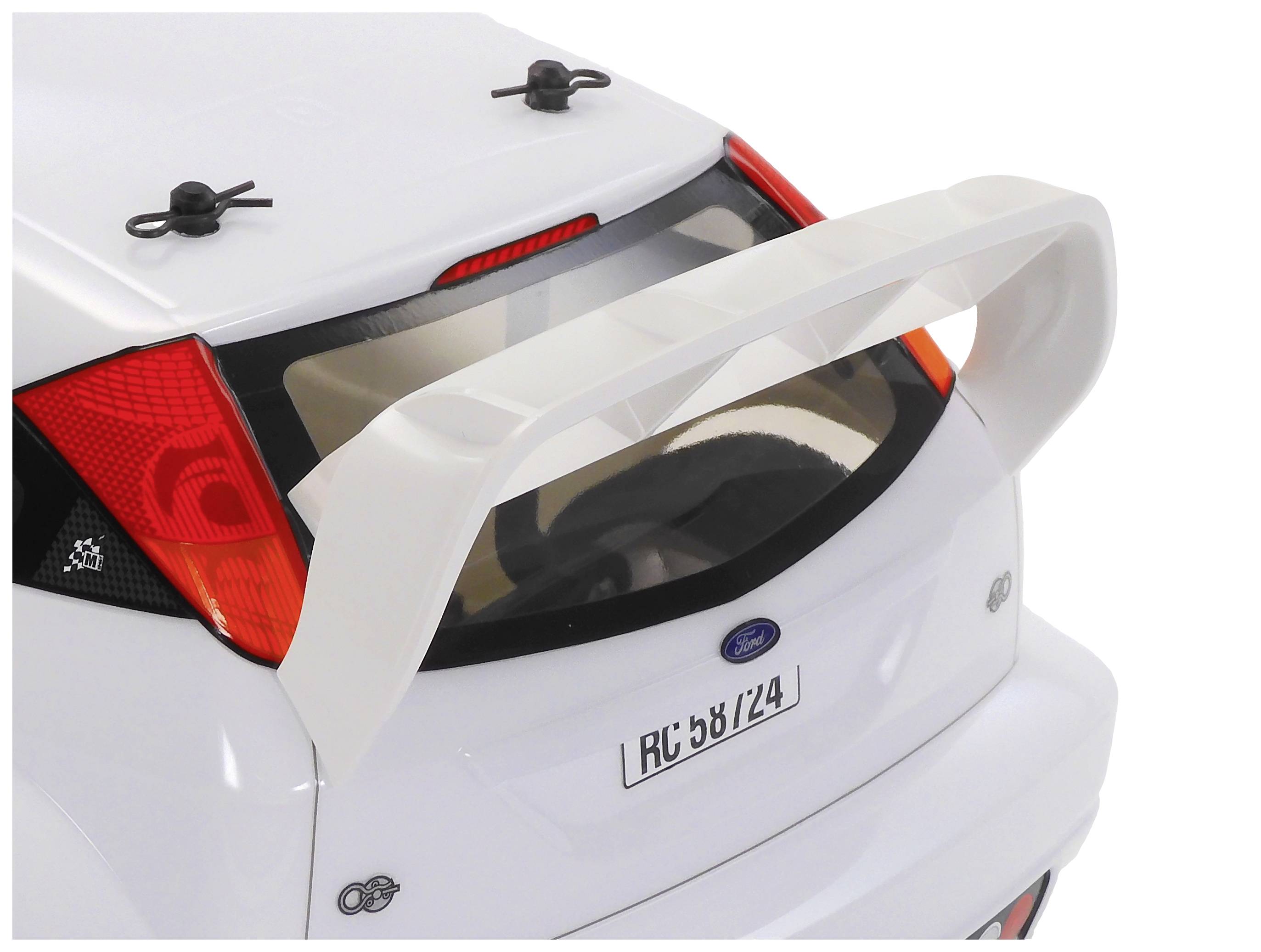 Białe autko modelarskie z dużym lotką tylną i czerwoną lampą tylną. Na tablicy rejestracyjnej widnieje napis 'RC 6B/24'.