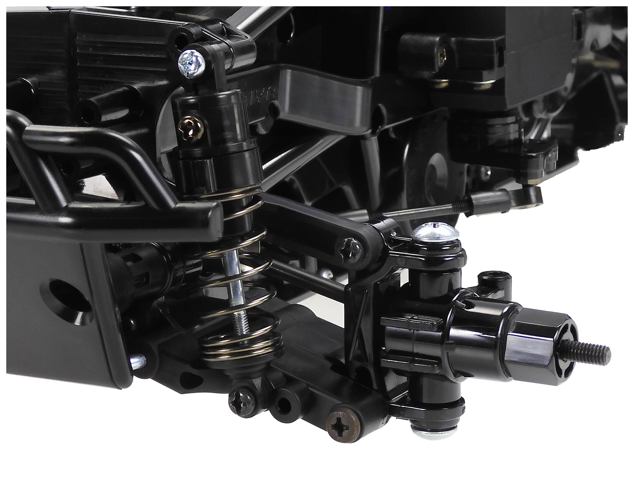 Zbliżenie złożonego urządzenia mechanicznego z sprężynami, śrubami i osiami, które wydają się być częścią większego systemu technicznego.