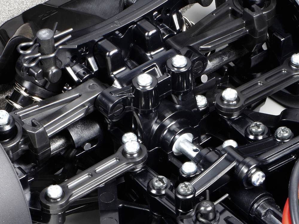 Zbliżenie skomplikowanego elementu mechanicznego z wieloma śrubami i metalowymi częściami. Prawdopodobnie fragment jakiegoś pojazdu.