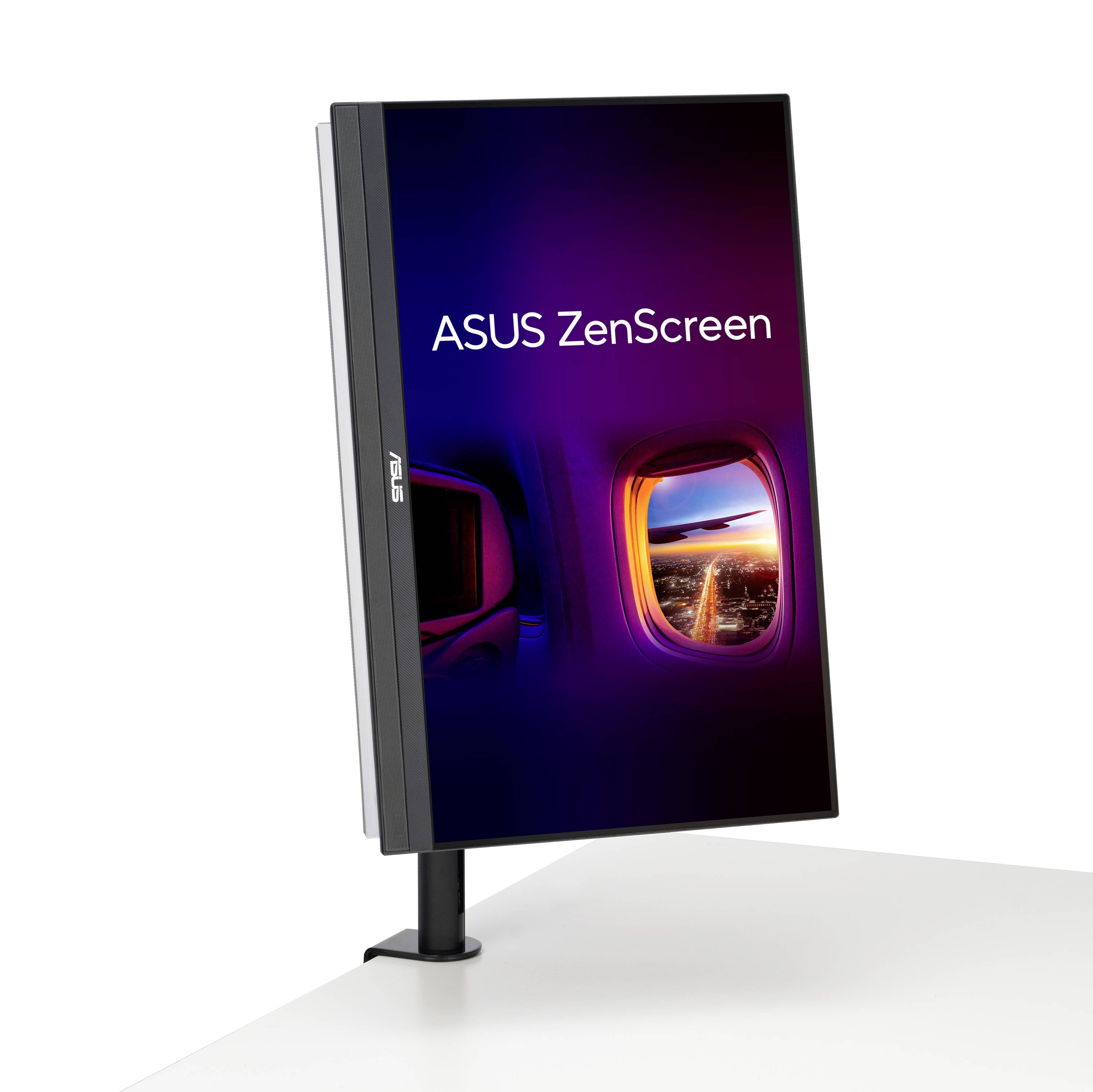 Przenośny monitor ASUS ZenScreen, stojący pionowo na stole. Ekran wyświetla podświetlony na pomarańczowo-różowo bulaj.