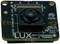 Mała, kwadratowa kamera z obiektywem centralnym oraz oznaczeniami 'LUX' i specyfikacjami technicznymi na płytce drukowanej.