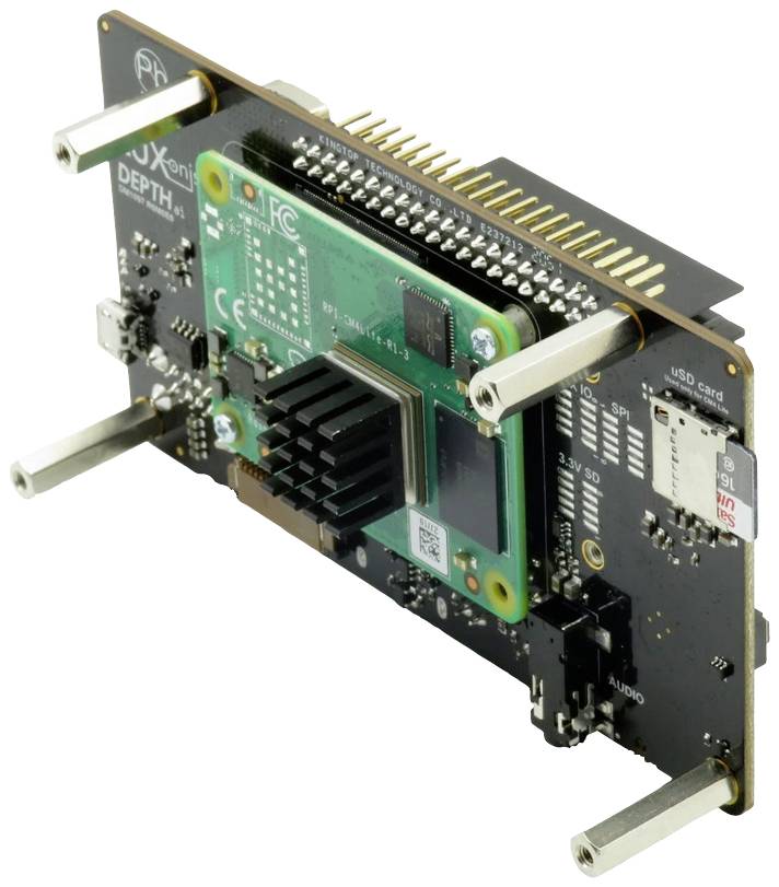 Zielona płytka elektroniczna z czarnym radiatorem jest zamontowana na czarnej płycie głównej. Widoczne są złącza i stojaki.