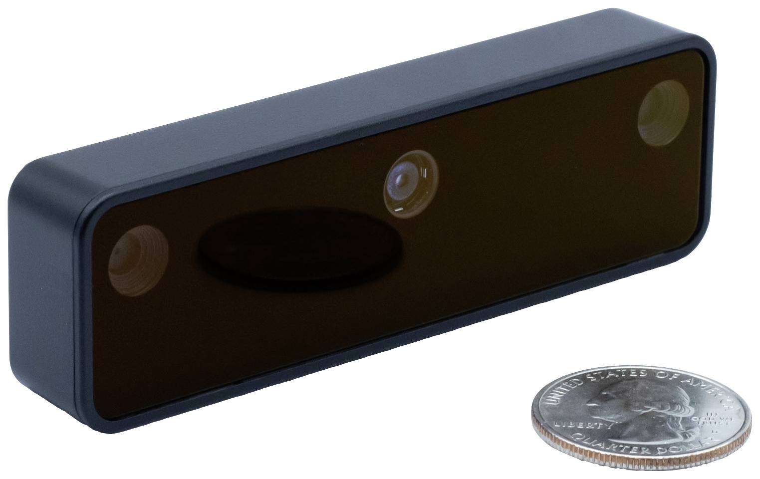 Prostokątna listwa czujnikowa obok monety w celu zilustrowania rozmiaru.