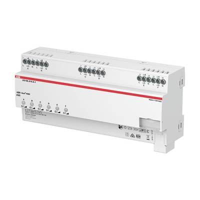 Białe, prostokątne urządzenie elektryczne z wieloma gniazdami i czerwoną linią u góry. Na ilustracji widoczne są przyciski i symbole.