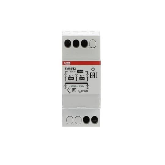 Białowy elektryczny element elektroniczny z napisami i symbolami, używany w instalacjach szaf sterowniczych, o wymiarach około 7 x 3 cm.