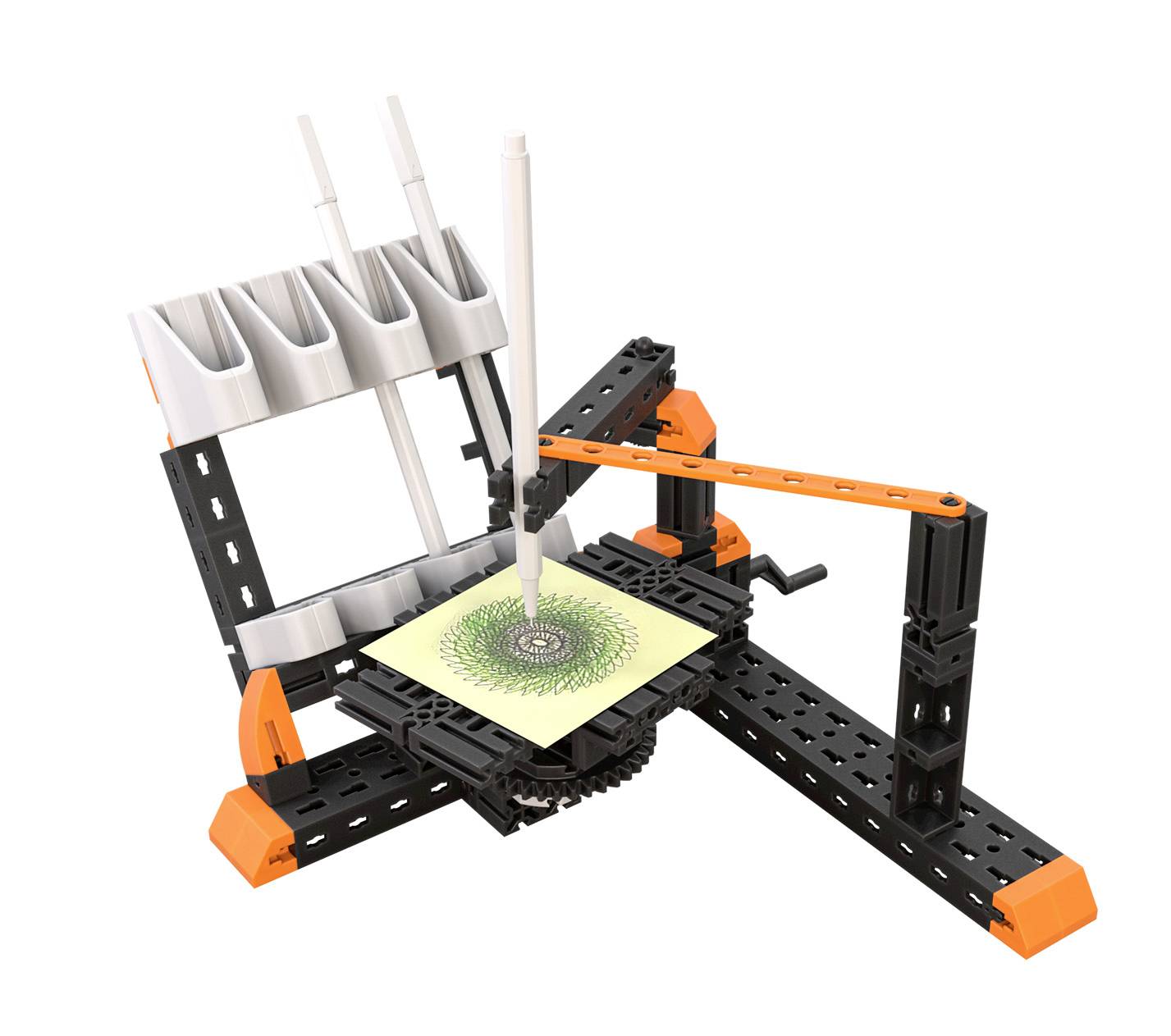 Urządzenie z piórami rysuje złożony wzór na papierze leżącym na stole; widoczne są mechaniczne ramiona i akcesoria.