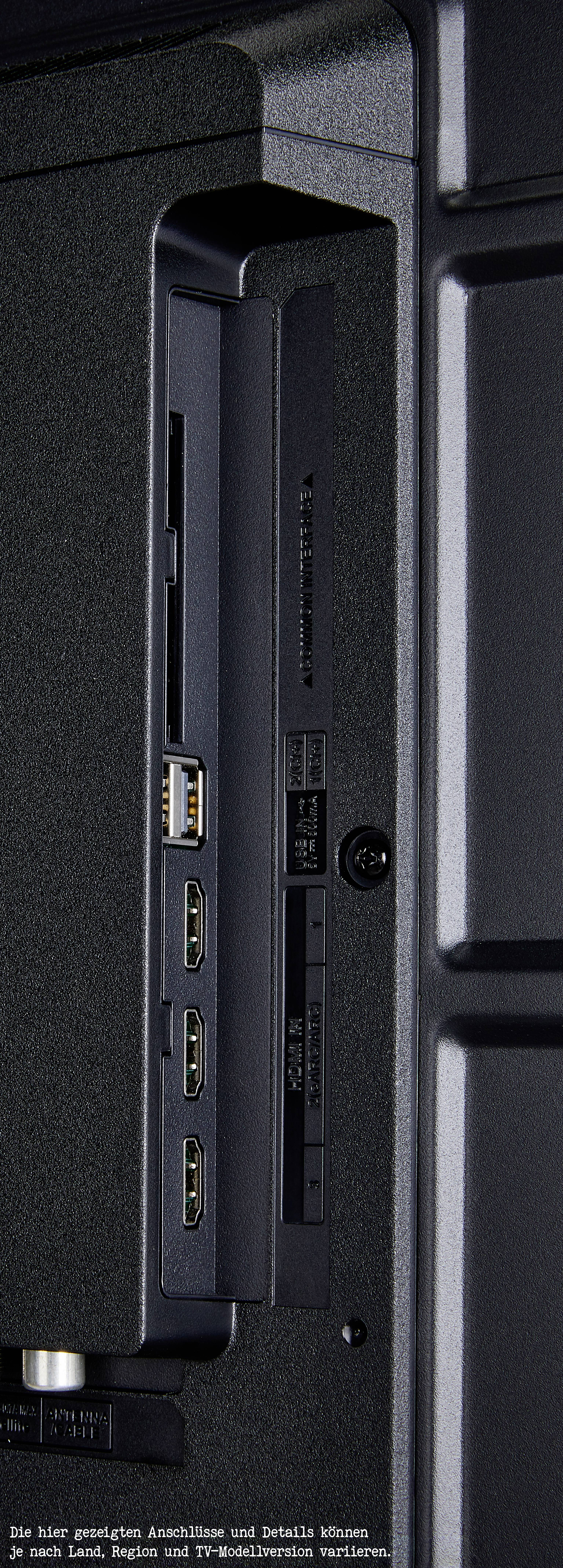 'Widok z boku czarnego urządzenia elektronicznego z wieloma portami: HDMI, USB i Ethernet.'
