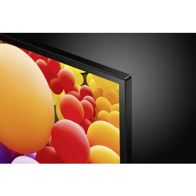 Telewizor wyświetla kolorowy obraz z wieloma żółtymi i czerwonymi balonami.