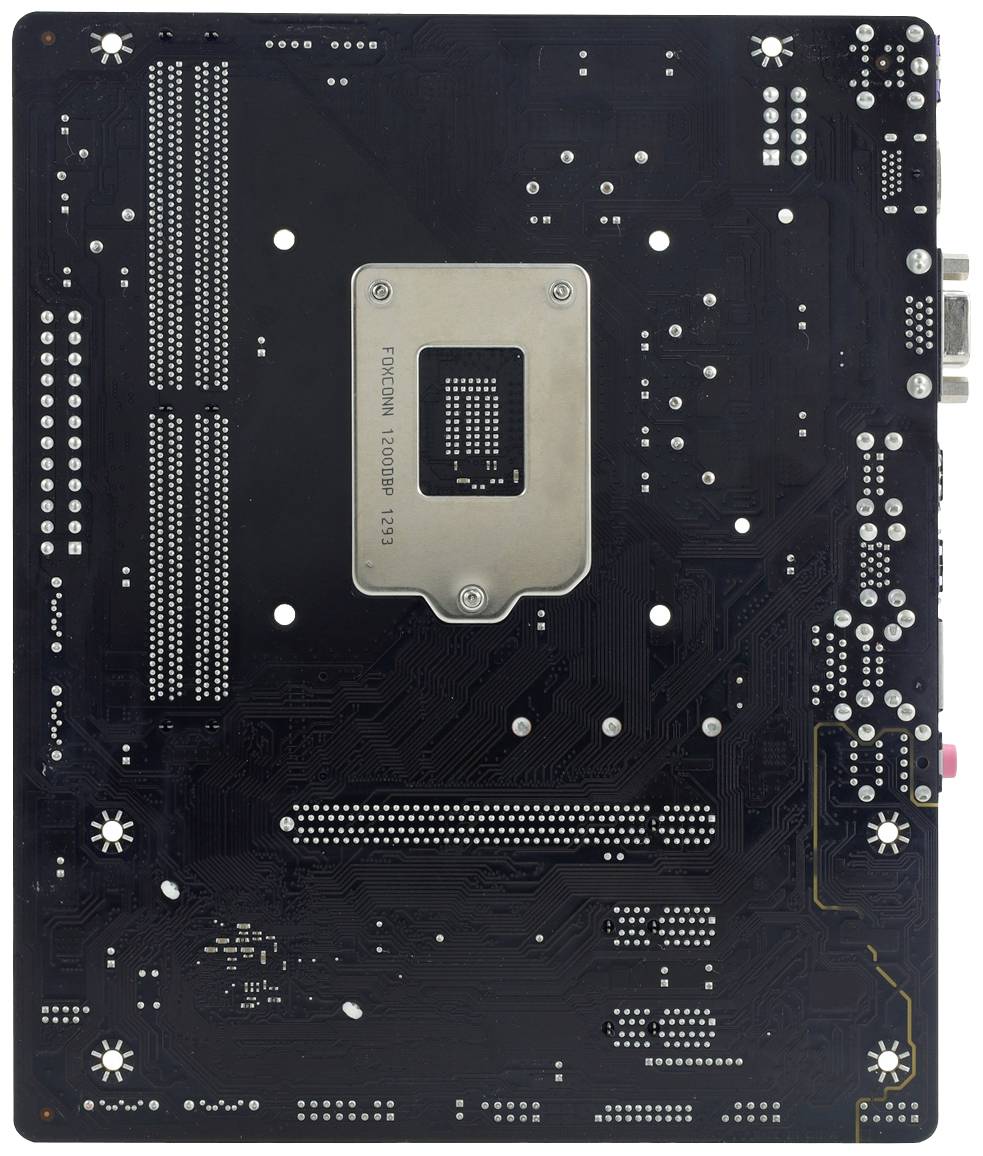 Tylna strona płyty głównej komputera z widocznymi obwodami elektronicznymi i metalowym obszarem pośrodku.