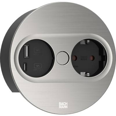 Okrągłe metalowe gniazdo elektryczne z jednym złączem Schuko oraz dwoma portami USB. Nazwa marki 'BACHMANN' wydrukowana u dołu.