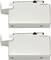 Dwa białe, prostokątne obudowy metalowe z bocznymi uchwytami montażowymi, ułożone jeden nad drugim. Przeznaczenie niespecyfikowane.