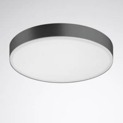 Okrągła, płaska lampa sufitowa z ciemną ramką i białym kloszem na szarym tle.