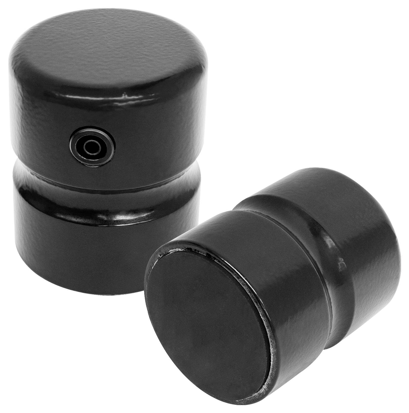 Dwie czarne, cylindryczne metalowe elementy, jeden z małym otworem z boku.