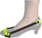 Szary damski but na niskim obcasie z czarnym i neonowozielonym paskiem przewiązanym przez stopę.