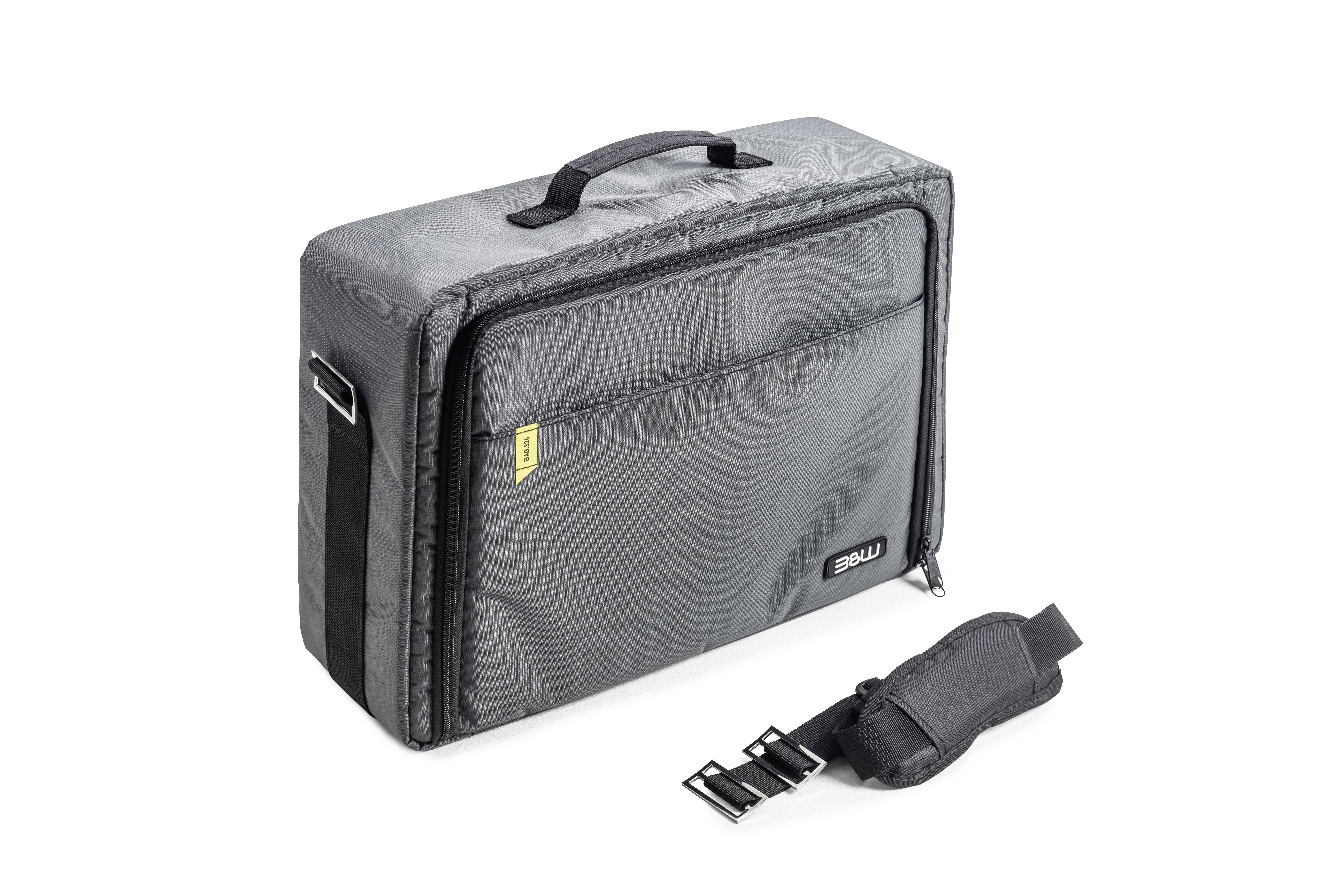 Szara torba ochronna z uchwytem i zdejmowanym paskiem na ramię. Torba posiada dużą kieszeń przednią i jest przeznaczona do transportu.