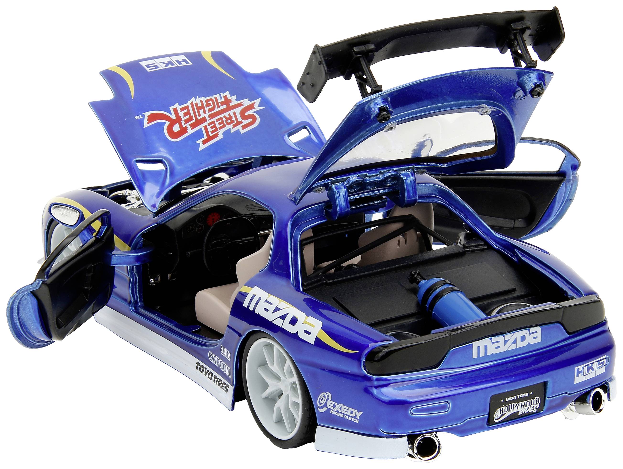 Niebieskie autko zabawkowe w stylu tuningu wyścigówki z otwartymi drzwiami, pokrywą silnika i spoilerem. Prezentuje szczegółowe wnętrze oraz logo.