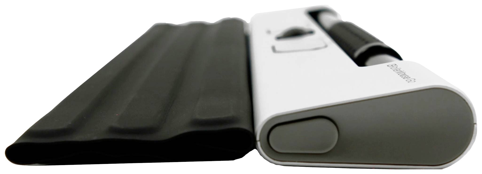 Białe urządzenie z czarnym gumowym uchwytem, leżące płasko na powierzchni. Wygląda na sprzęt kuchenny.