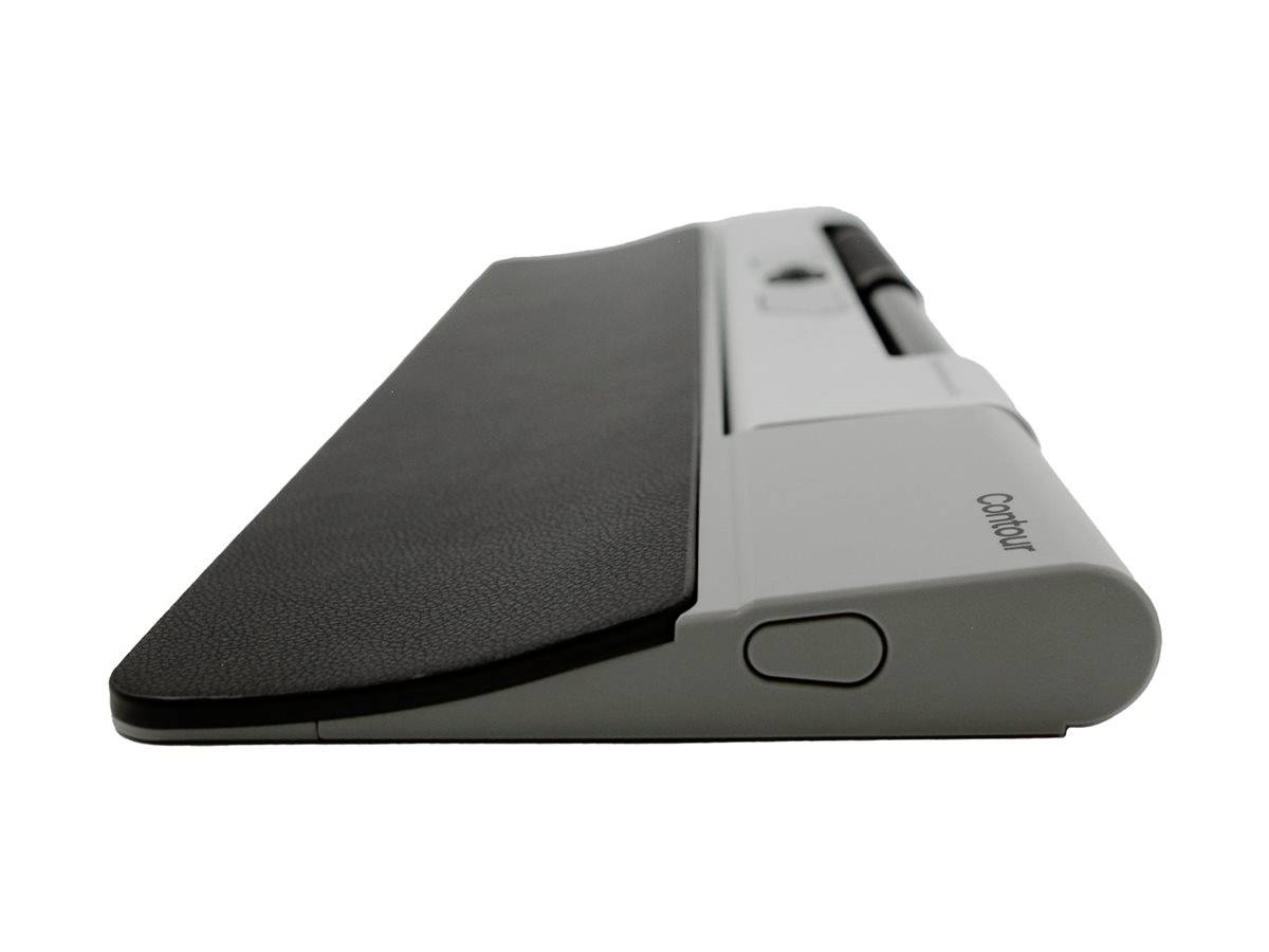 Ergonomiczne urządzenie wprowadzania danych z podparciem dla nadgarstka, widziane z boku, w kolorze szarym z czarną powierzchnią.