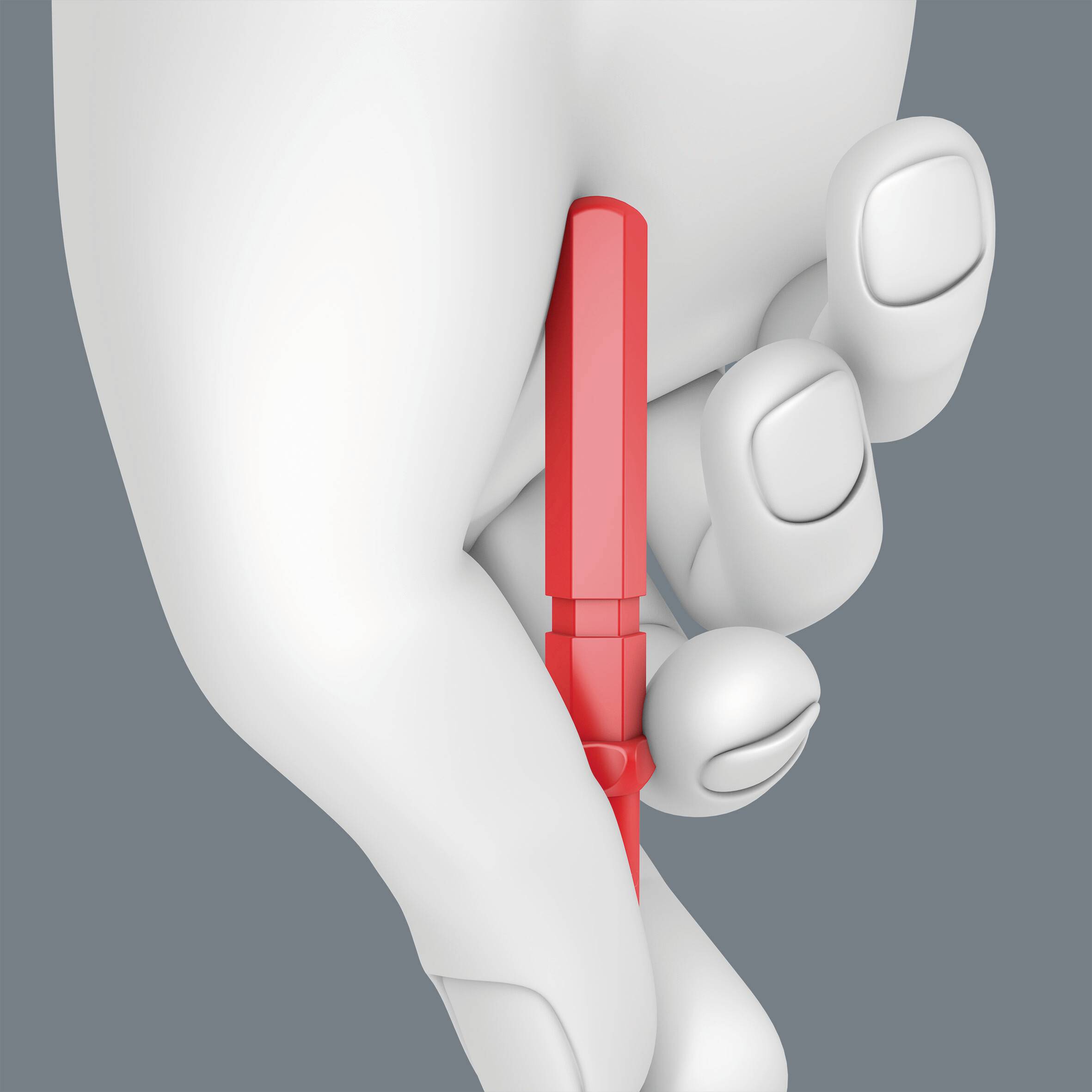 Biała dłoń trzyma między kciukiem a palcem wskazującym czerwony, podłużny przedmiot na szarym tle.