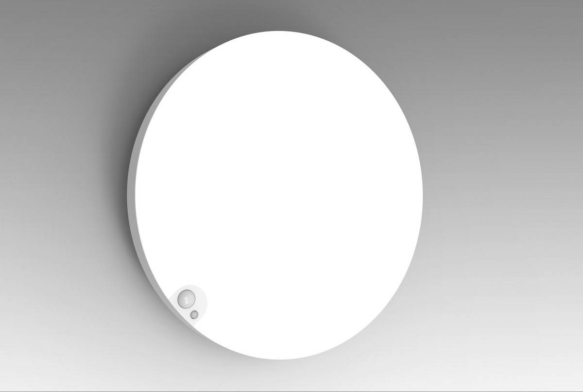 Biały plastikowy zegar ścienny na szarym tle, bez widocznych wskazówek lub cyfr.