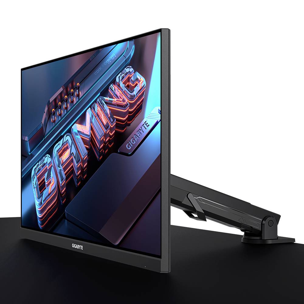 Monitor z napisem 'GAMING', zamontowany na regulowanym ramieniu, zapewniającym elastyczne ustawienie ekranu.