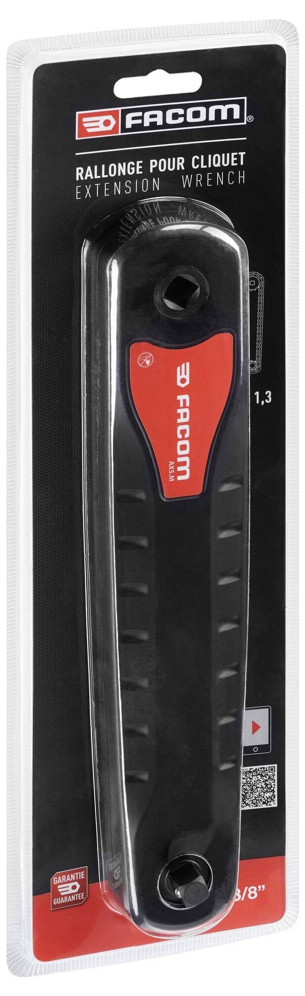 Przedłużka 'Facom' do grzechotki, w czarnym opakowaniu. Zawiera opis i logo marki.