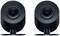 Dwa czarne, okrągłe głośniki o minimalistycznym designie ustawione obok siebie, każdy z centralną membraną.