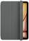 Tablet w szarym etui, częściowo otwarte, wyświetlające pomarańczowy ekran.