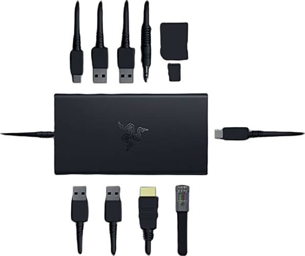 Czarna ładowarka z różnymi wymiennymi wtyczkami do USB, HDMI i innych złączy, ułożonymi symetrycznie.