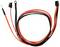 Dwa kable, jeden w kolorze czerwonym i czarnym, zakończone złączkami. Jeden posiada złącze pierścieniowe, drugi ma otwarty przewód.
