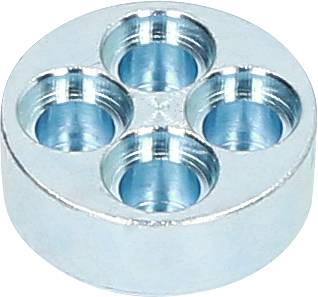 Okrągły blok metalowy z czterema równomiernie rozmieszczonymi wgłębieniami na powierzchni.