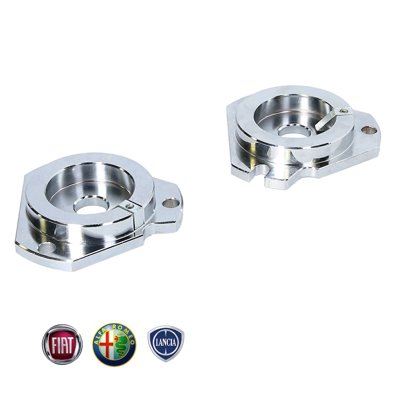 Dwie błyszczące, srebrne metalowe części do zawieszenia pojazdów, w tym logo Fiata, Alfa Romeo i Lancii.