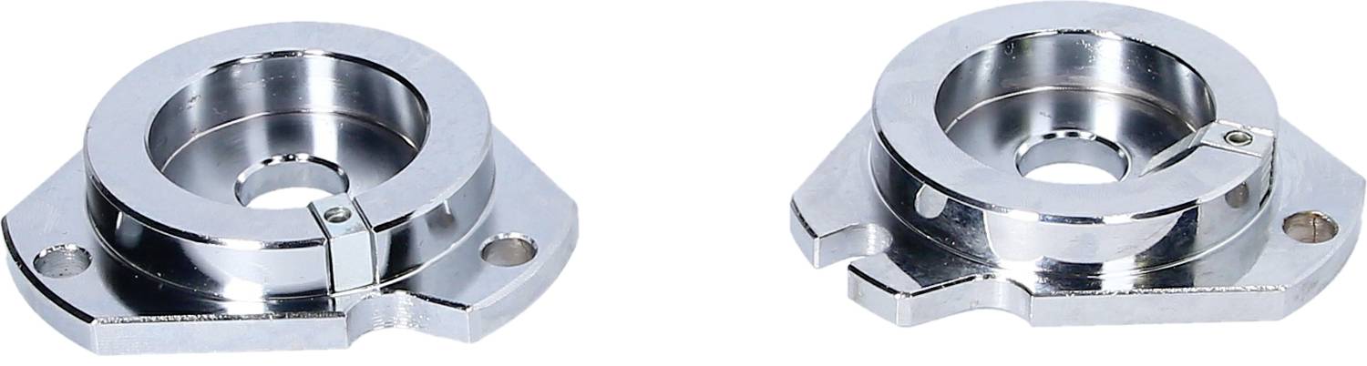 Dwa metalowe obudowy łożysk kołnierzowych wykonane z polerowanej stali. Posiadają okrągłe otwory wewnętrzne i są przeznaczone do mocowania w maszynach.