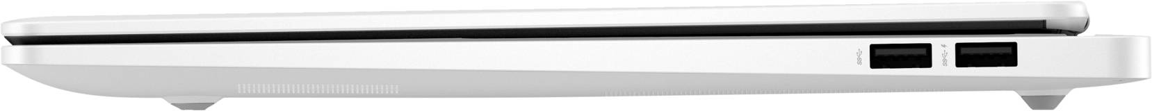 Zamknięty, biały laptop widziany z boku, umieszczony na stole. Po lewej stronie lekko zakrzywiona podstawa, po prawej złącza i szczeliny wentylacyjne.