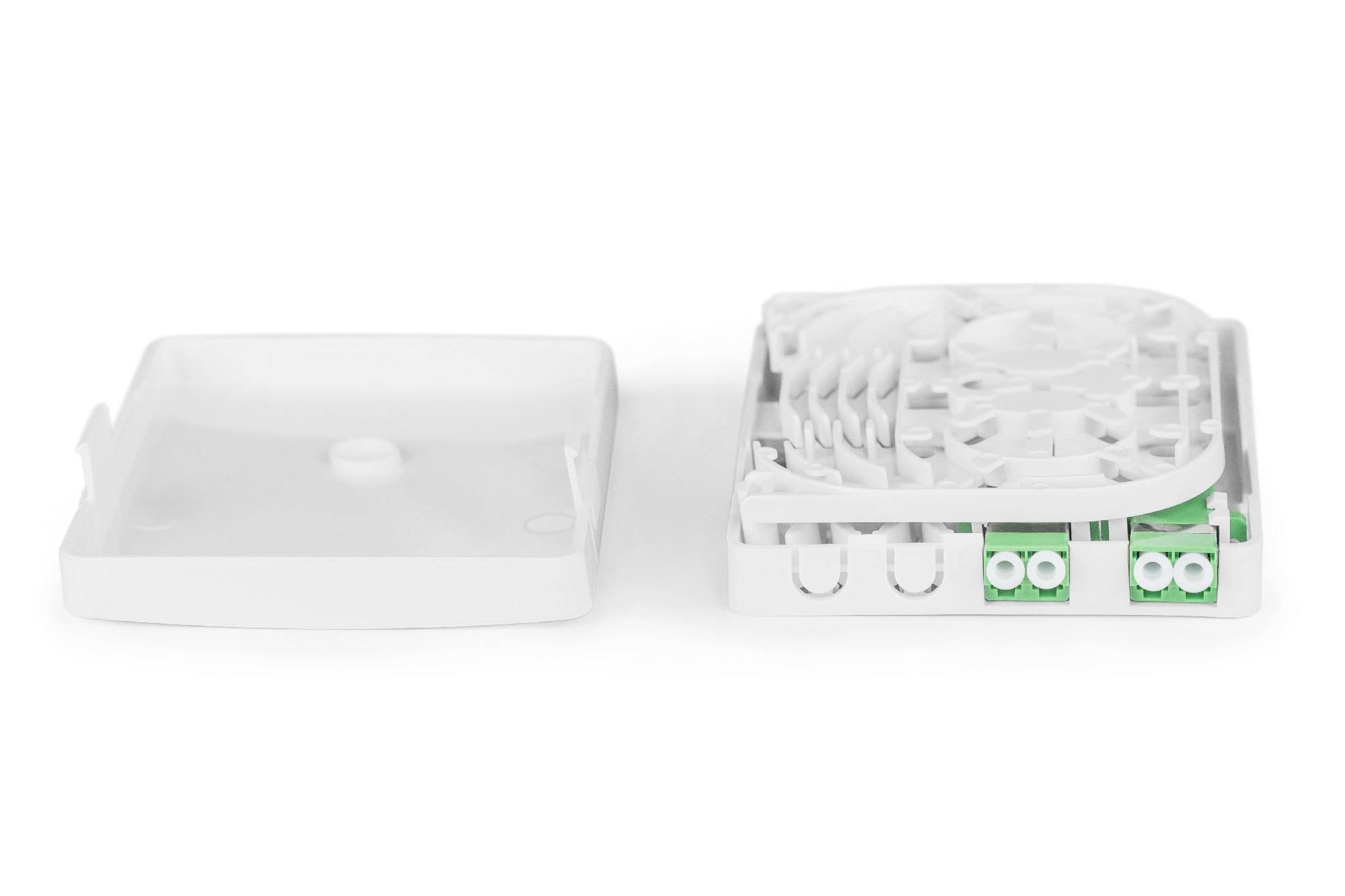 Białe, prostokątne obudowa, częściowo otwarta, z zielonymi gniazdami i strukturą kołową, odpowiednia do instalacji światłowodowych.